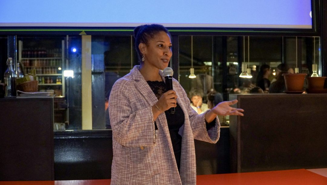 women giving a speech on a stage